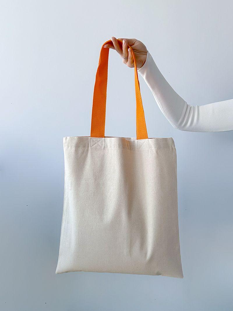 Світло-бежева натуральна сумка з кишенею та яскравими помаранчевими ручками, без друку, розмір: 38см х 42см