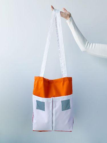 Помаранчева сумка з білими кишенями та світловідбивними вставками, на довгій зручній ручці, без друку, розмір: 36см х 40см х 8см