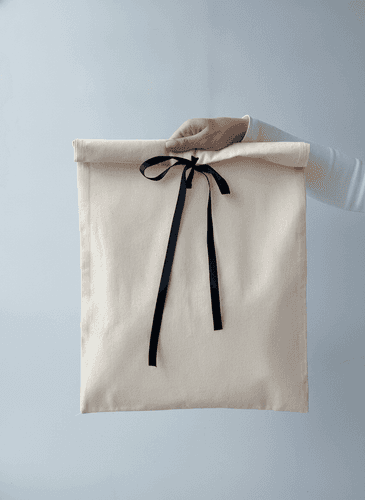 Calico pouch with ribbon tie and flap
