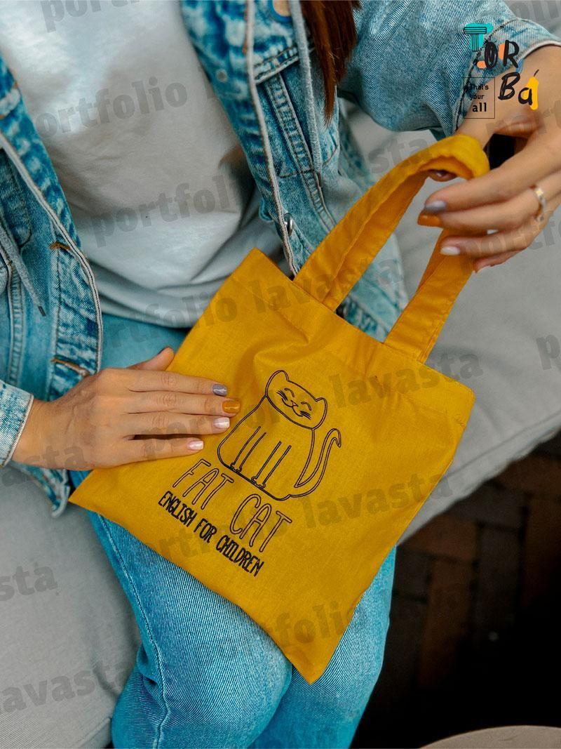 Маленька торба з тонкого котону жовтого кольору без друку