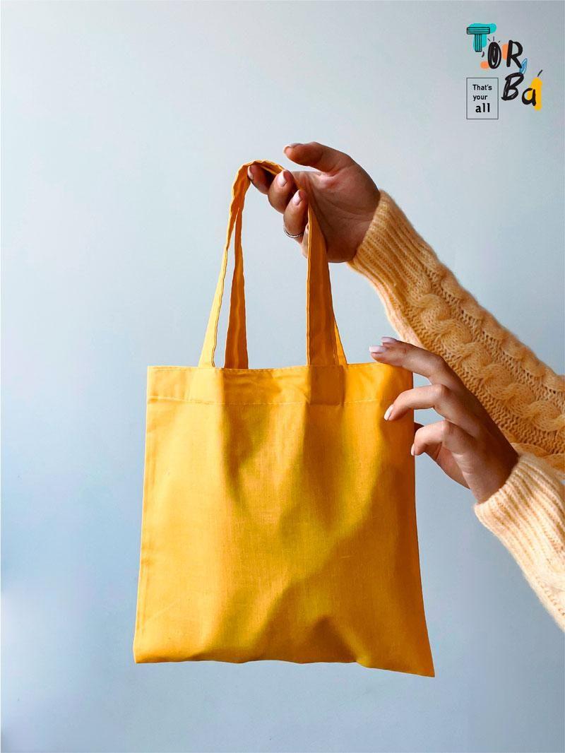 Маленька торба з тонкого котону жовтого кольору без друку